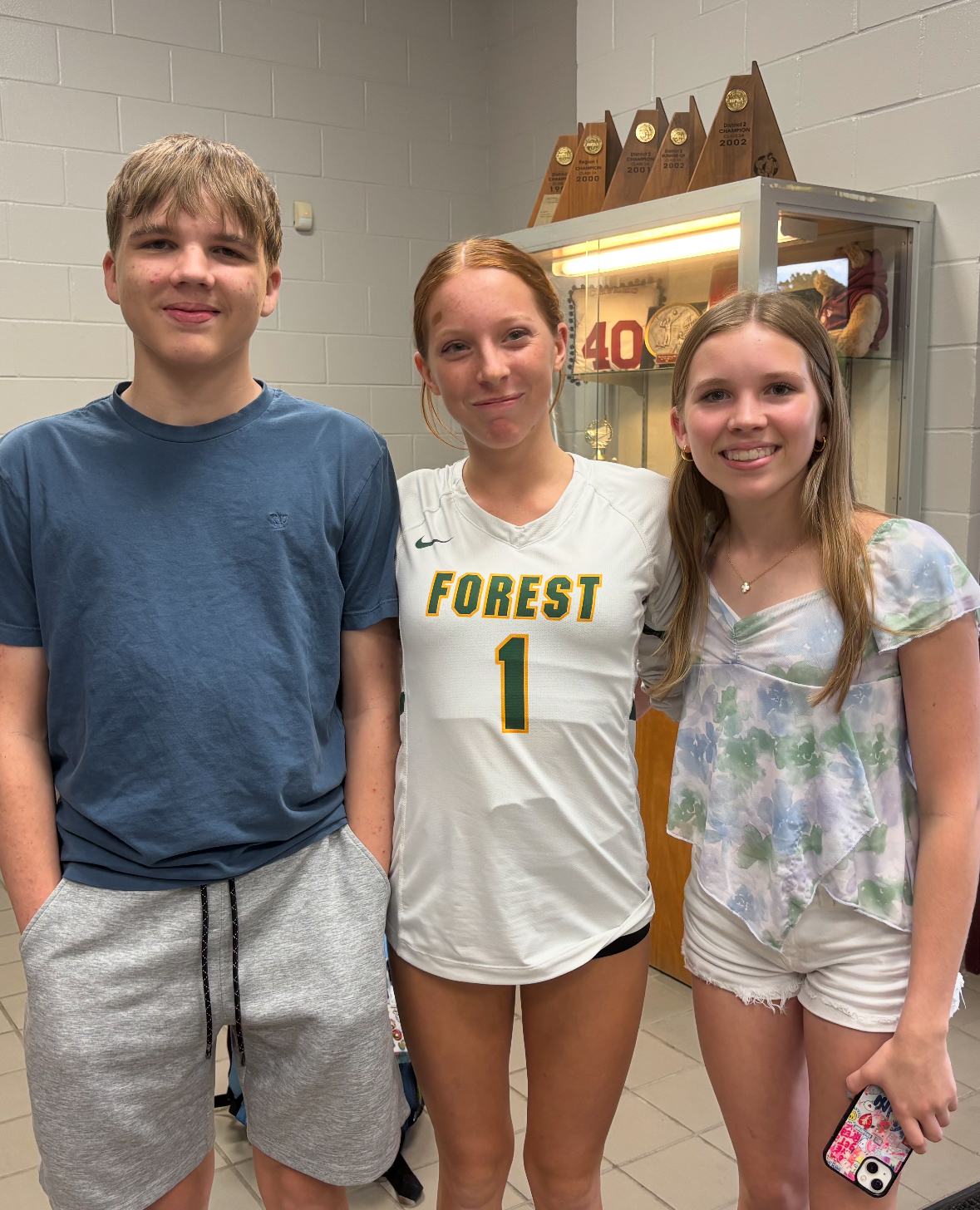 Athletes and community members participating in a meaningful volunteer activity together, demonstrating compassion and service in an outdoor community setting, showing expressions of purpose and shared connection